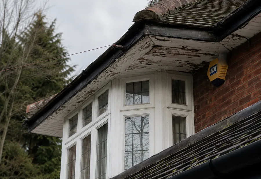 Peeling paint and soft wood on fascia, North Vancouver
